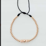 Pulsera tejida oro rosa con balín #6 #4 #3 y neopreno doble cinta