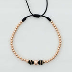 Pulsera tejida oro rosa con balín #6 #4 #3 y neopreno doble cinta