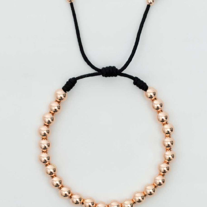 Pulsera tejida oro laminado rosa con balín #4