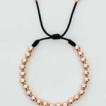 Pulsera tejida oro laminado rosa con balín #4