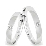 Argollas liso brillante zircon centro suizo blanco