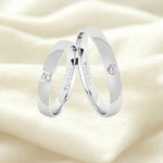 Argollas liso brillante zircon centro suizo blanco
